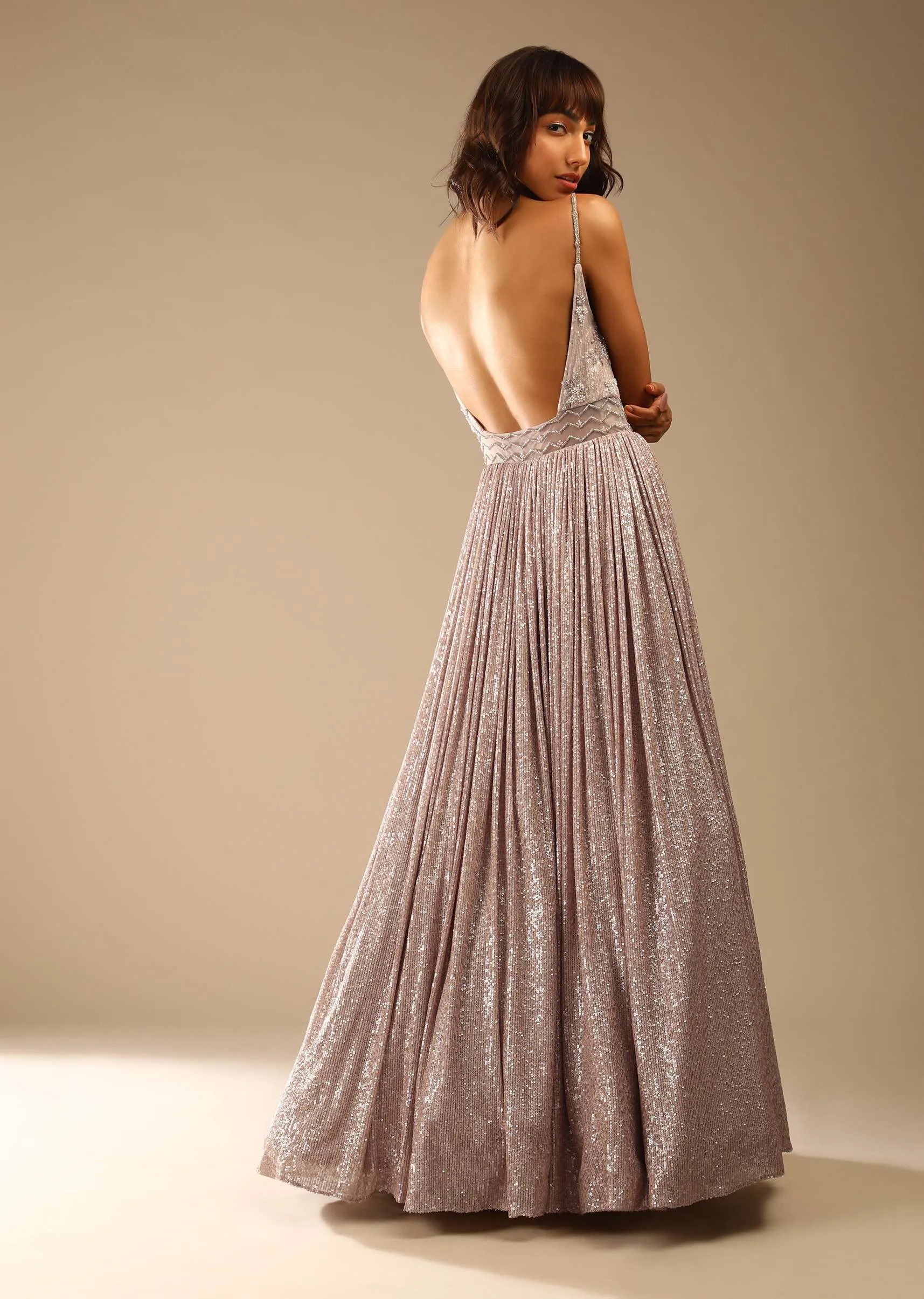Champagne Gown Embellished In Sequins With Cut Dana Embellished Sheer Net On The Waist And Criss Cross Straps On The Neckline Online - Kalki Fashion